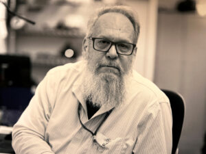 B&W photo of man with glasses and beard